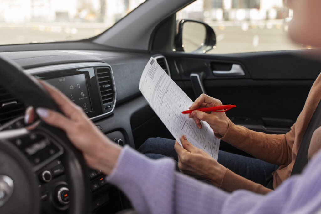 Woman taking her driver s license test vehicle